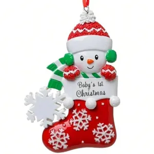 Personalized resin snowman Christmas stocking ornament for baby's first Christmas decoration.