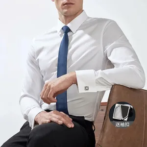 Detailed macro view of a white slim-fit business dress shirt with blue tie and cufflinks.