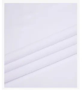 Close-up view of the breathable white fabric texture and diagonal folds for men's casual shirt