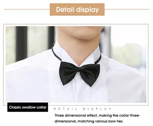 Detail view of a men's white formal tuxedo shirt with a black bow tie and swallow collar