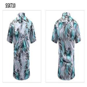 Detailed front and back views of a vintage men's Hawaiian shirt with teal tropical prints