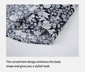 Gros plan sur l'ourlet arrondi élégant de cette chemise pour homme à fleurs.