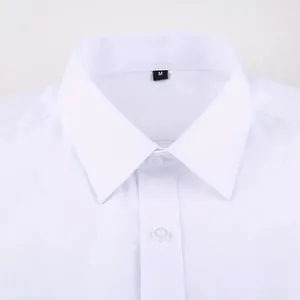 Detail shot of white long-sleeved French shirt collar showing fabric texture and buttons