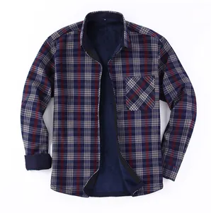 Detailed view of men's blue plaid shirt with warm navy fleece lining and chest pocket.