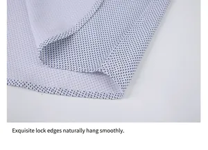 Close-up view of the refined lock-stitched hem on a patterned men's casual shirt.