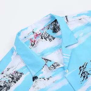 Close-up of blue vintage Hawaiian print shirt with classic Cuban collar detail.