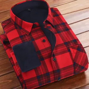 Men's red and black plaid shirt with warm fleece lining on a wooden background