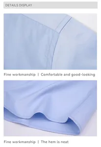 Detailed view showing the fine workmanship and neat hem of a light blue dress shirt