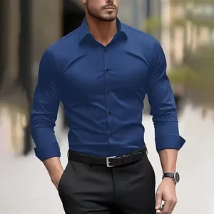 Close-up of navy blue men's polyester long sleeve dress shirt with slim fit design