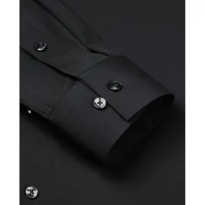 Close-up of a premium black four-way stretch long sleeve dress shirt cuff for men