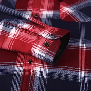 Men's red and blue plaid flannel long sleeve shirt detail with cuffs and buttons