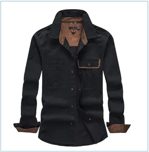 Front view detail of a black men's long sleeve cotton work shirt with brown corduroy collar.