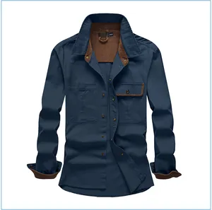 Detail of navy cotton work shirt with brown corduroy contrast collar and cuffs.
