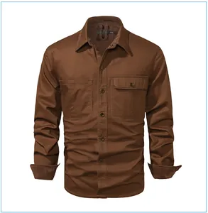 Detail of brown men's corduroy work shirt with chest pockets and textured fabric finish.