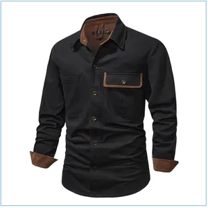 Detail view of black cotton workwear shirt with brown corduroy collar and cuffs
