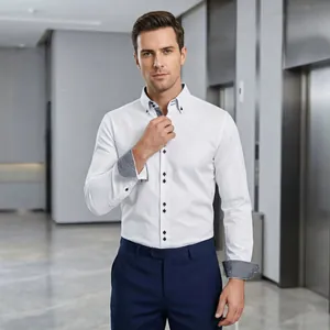 Detailed view of a white business shirt with patterned inner collar and dark buttons