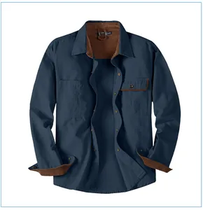 Detailed view of navy blue cotton workwear shirt with brown corduroy contrast collar.
