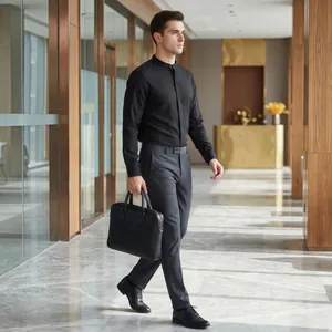 Professional male model in black mandarin collar shirt holding a briefcase in an office
