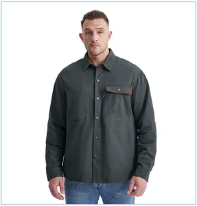 Detailed view of men's dark grey work shirt with contrast corduroy pocket trim
