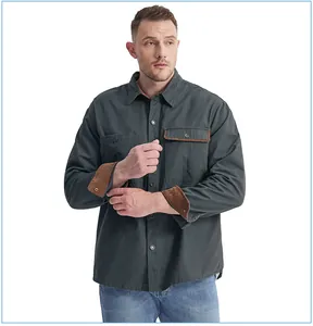 Detail of men's cotton work shirt featuring contrast corduroy cuffs and pocket trim.
