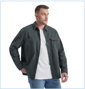 High-quality detail view of men's loose cotton work shirt with corduroy pocket accent