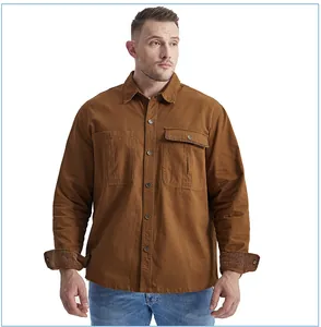 Detailed view of men's brown cotton workwear shirt featuring corduroy contrast cuffs