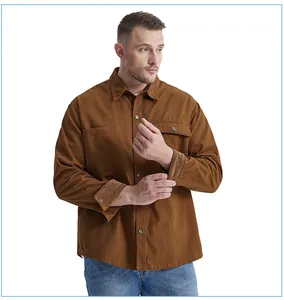 Close-up of men's brown cotton work shirt with corduroy contrast cuffs and flap pockets
