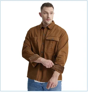Detail view of men's brown cotton work shirt with contrast corduroy cuff design