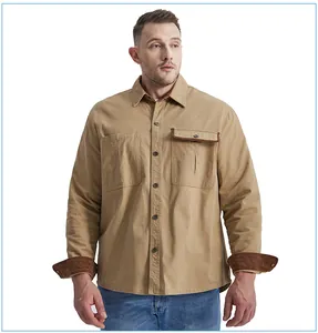 Detail of a khaki cotton workwear shirt with contrast corduroy trim on the cuffs