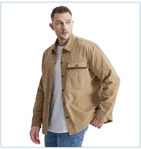 Detail view of men's khaki cotton work shirt featuring a contrast corduroy collar detail.