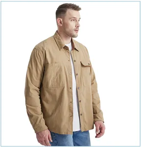 Detail view of men's khaki cotton workwear shirt with contrast corduroy collar and pockets