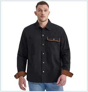Detailed view of a black cotton men's workwear shirt featuring brown corduroy accents on cuffs