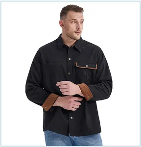 Detail view of men's black work shirt featuring brown corduroy cuffs and contrast collar