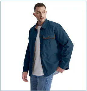 Detail view of men's blue workwear cotton shirt with corduroy collar contrast
