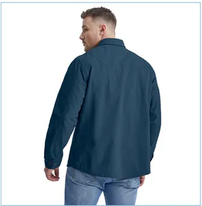 Detailed back view of a men's loose fit blue corduroy work shirt with premium fabric texture