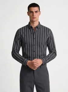Detailed view of men's dark navy vertical striped long-sleeved button-down shirt