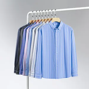 A collection of striped long-sleeved men's button-down shirts hanging neatly on a white rack