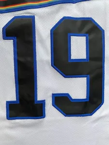 Close-up of retro white basketball jersey with embroidered black and blue number 19