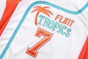 Close-up detail of Flint Tropics embroidery on white retro mesh basketball jersey