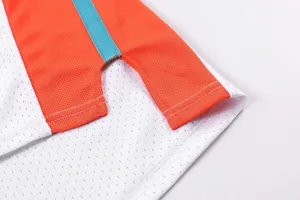 Detailed macro view of breathable mesh fabric and side split on a basketball jersey