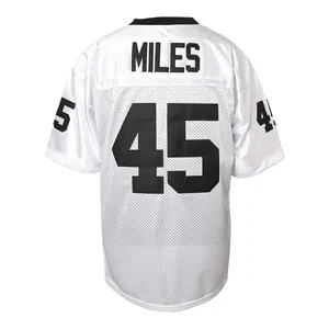 Detail view of white No. 45 football jersey with MILES name on back