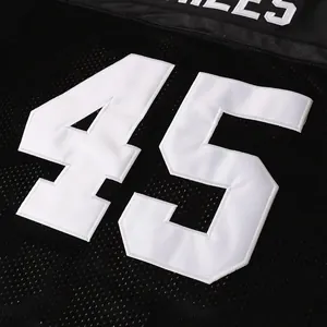Detailed view of the premium white embroidered number 45 on a black mesh football jersey