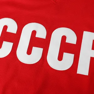 Close-up of high-quality white embroidered CCCP letters on a red vintage hockey jersey
