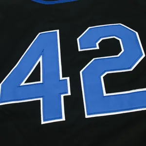 Detail of blue embroidered number 42 with white border on black baseball jersey