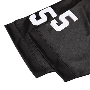 Detailed view of black American football jersey sleeve with white number 55 print