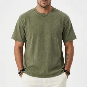 Detailed view of a heavyweight olive green washed vintage cotton t-shirt with round neck.