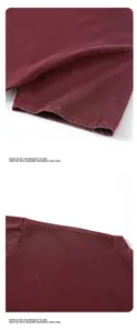 Macro detail of the washed vintage fabric and stitching of a burgundy cotton T-shirt