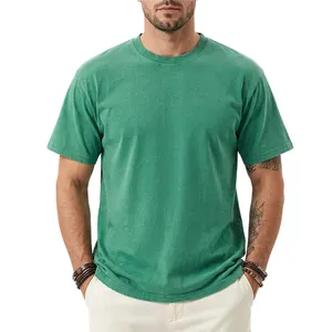Detail view of men's premium green washed distressed heavy weight cotton t-shirt on model