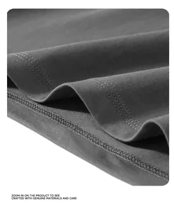 Detailed macro view of the professional double-stitched hem on a heavy 260G cotton t-shirt