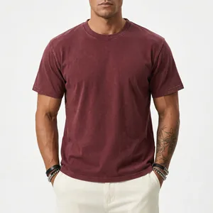 Front view detail showing the fabric texture of a heavyweight washed burgundy cotton t-shirt.